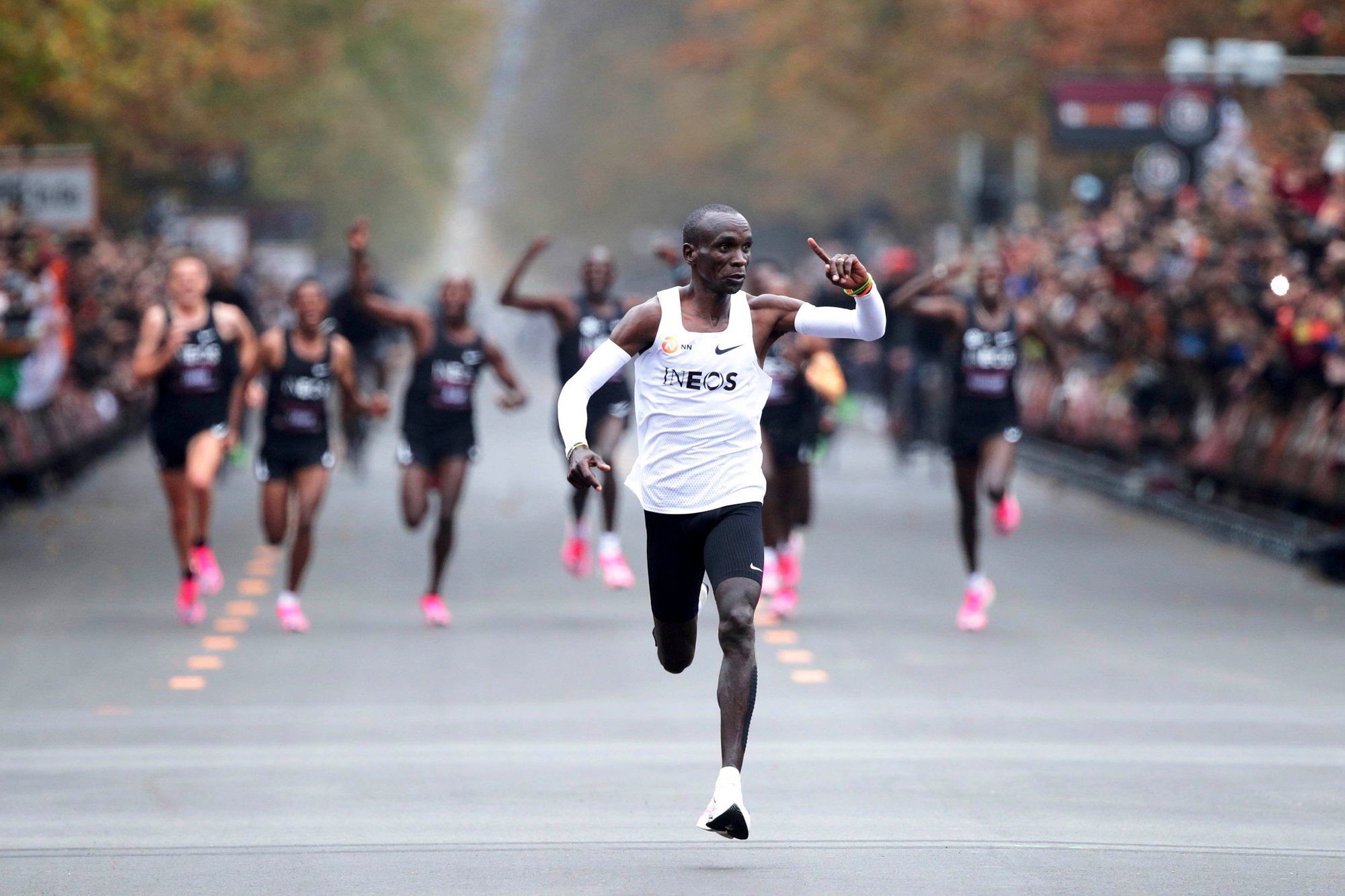 Eliud Kipchoge celebrates when passing the finish line at the INEOS 1:59 Challenge