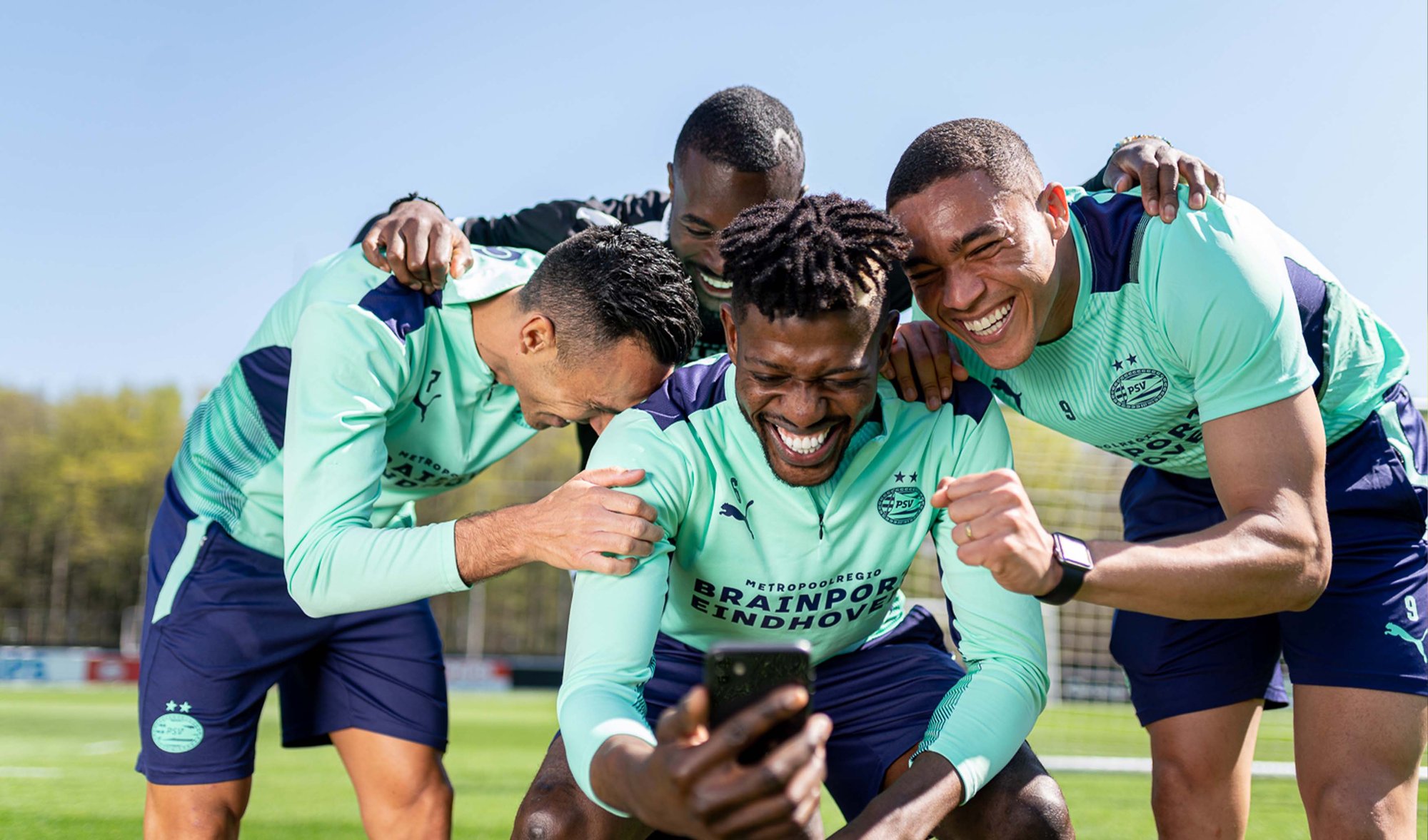 Laughing PSV players at photoshoot Anycoin Direct
