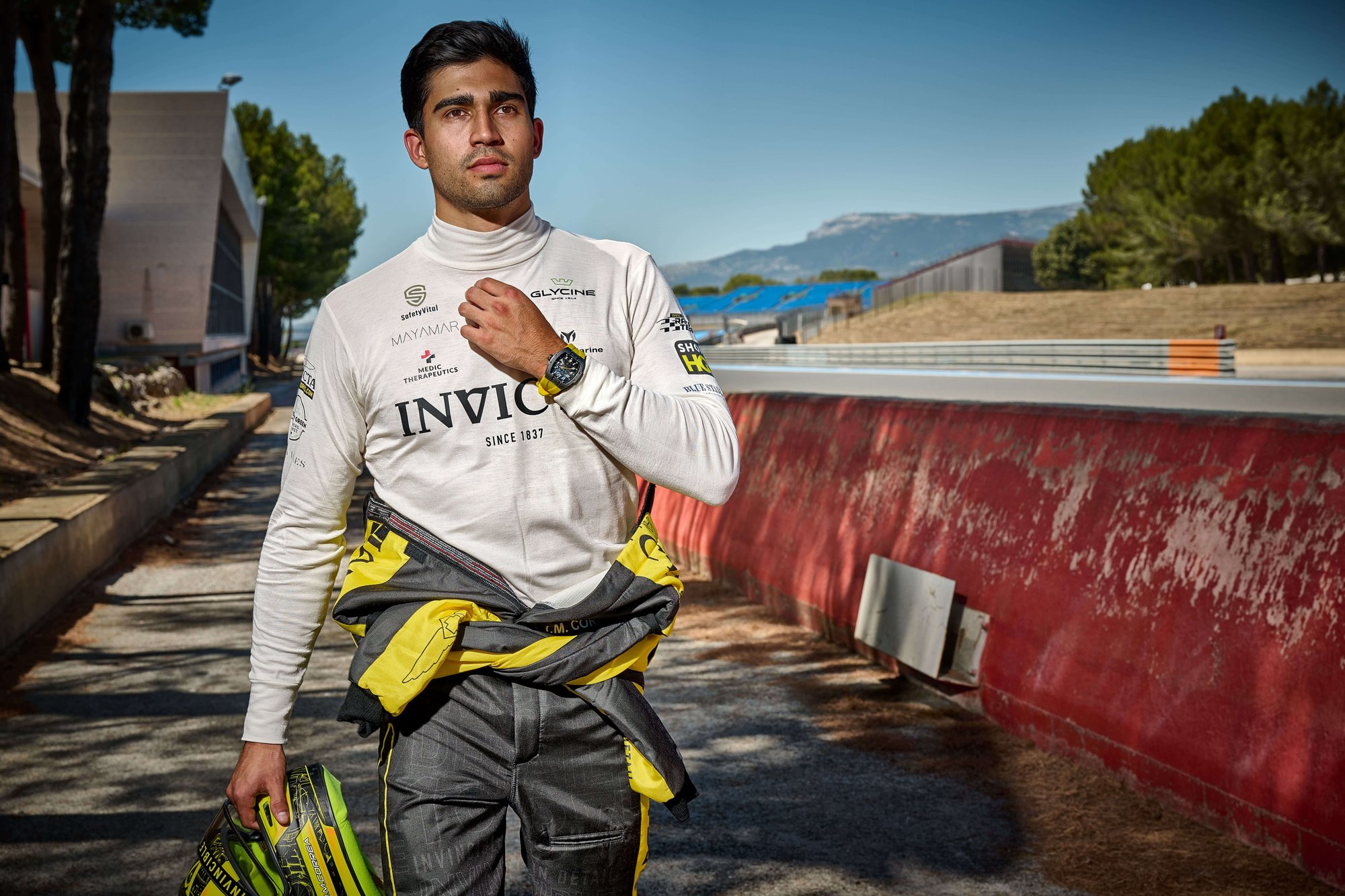Juan Manuel Correa in racing suit Invicta