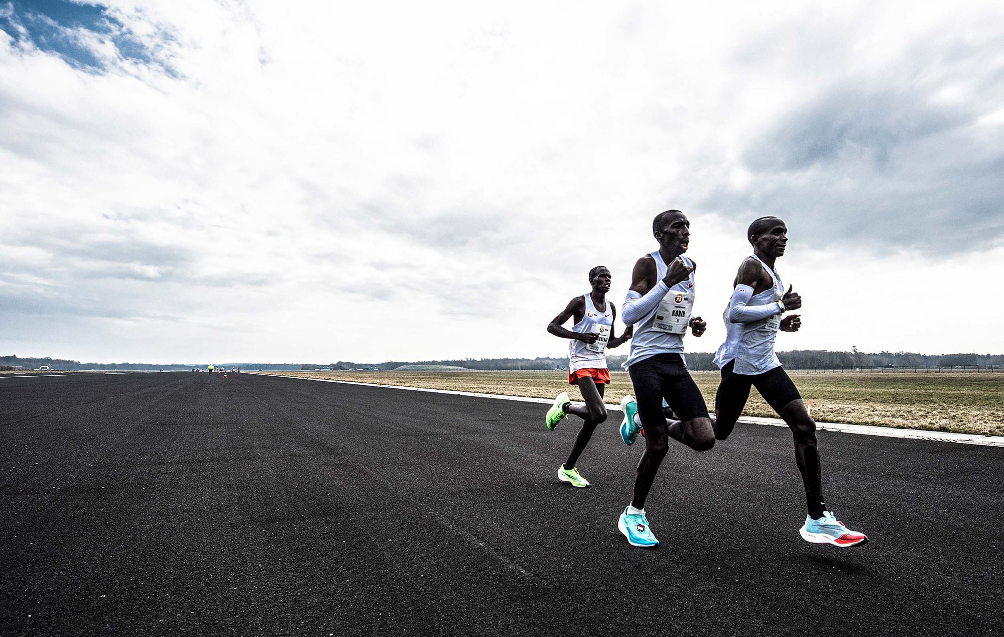  3 marathon runners running the mission marathon